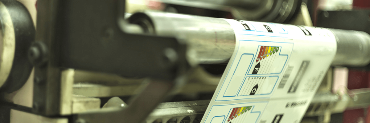 Close up of a label printer working, printing labels on a roll, specialty media printers or machines