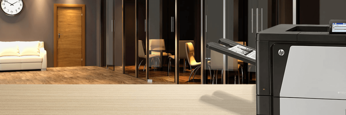 HP desktop printer on long desk or cabinet in a modern office